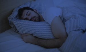 A person struggling with nighttime congestion